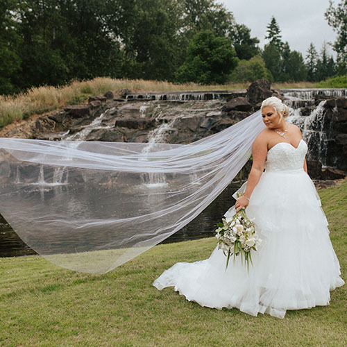 bride in front of waterfall